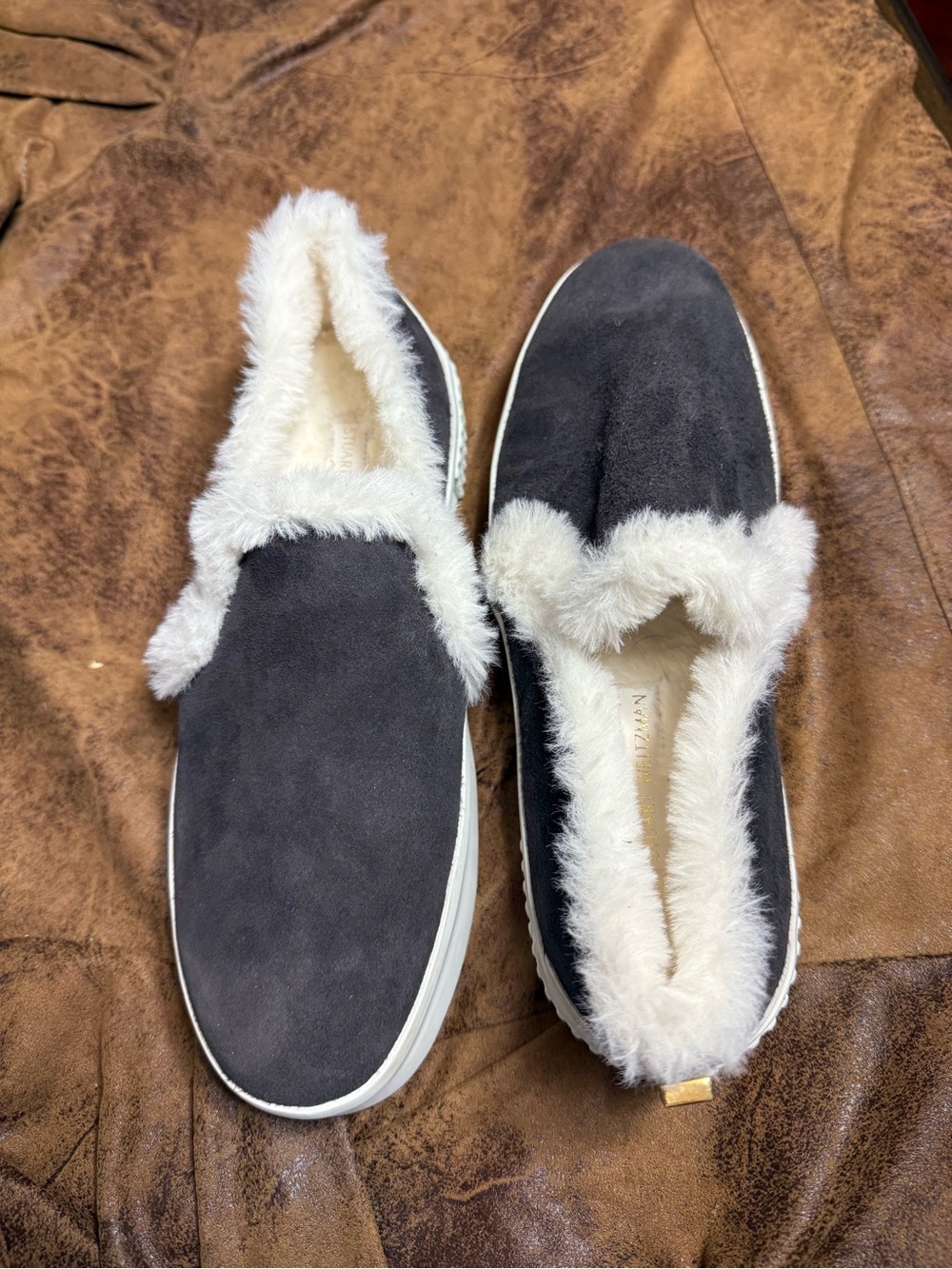 21. Stuart Weitzman Blue Suede Slip-On Sneakers with Cream Faux Fur Trim